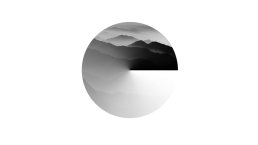 Logo design featuring layered mountain silhouettes in black and white within a circular frame for elements client