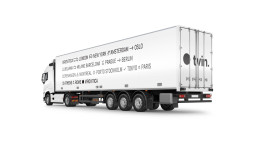 White semi-truck mockup with tvin logo and city destinations listed on trailer side, modern minimalist design