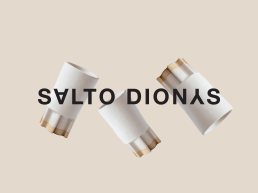 Logo for Salto Dionys featuring bold black typography overlaid on three white and gold cylindrical cosmetic tubes floating ag
