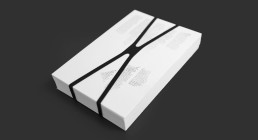 White minimalist book packaging with black elastic band, featuring clean typography and modern design for Viktor Žakelj publi