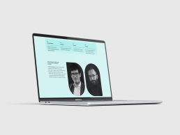 MacBook Pro mockup displaying nomia website with mint green background featuring two circular black and white portrait photos